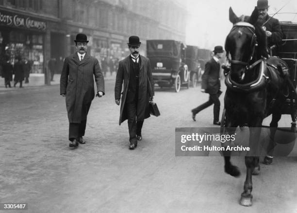 The Scottish politicians Ramsay MacDonald Britain's first Labour prime minister , and Arthur Henderson chairman of the Labour Party. Ramsay MacDonald...