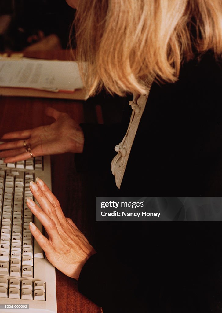 Woman at Computer Keyboard
