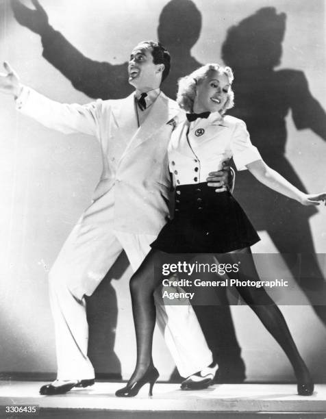 Actress, dancer and singer Betty Grable dances with Charles 'Buddy' Rogers in the musical comedy 'This Way Please'. As a publicity stunt her legs...