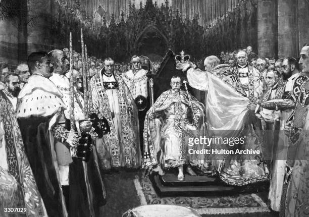 The Archbishop of Canterbury places the crown on the head of George V , during his Coronation at Westminster Abbey.