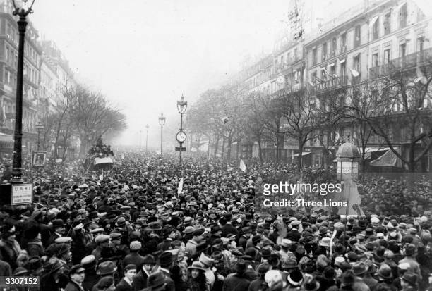 Crowd of Parisians celebrate the Armistice ending World War I, on the boulevards of Paris, 11th November 1918.