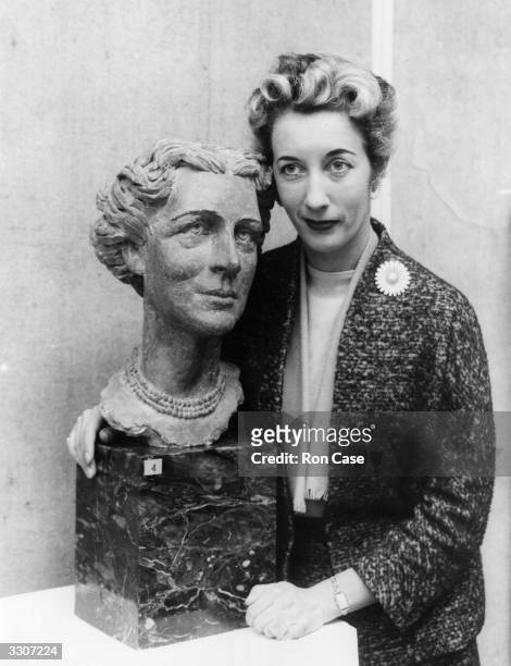 Sculptress Eva Castle with her bust of the Duchess of Kent, at the private view of the third Annual Exhibition of the Society of Portrait Sculptors...
