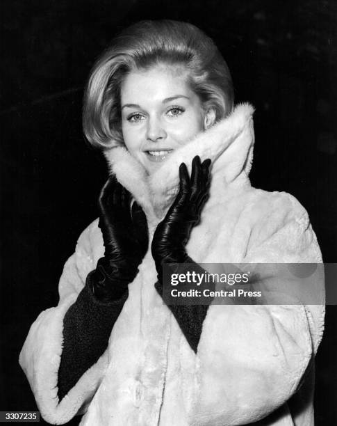 American actress Carol Lynley arrives in London for the premiere of Otto Preminger's new film, 'The Cardinal', which premieres on 20th December at...