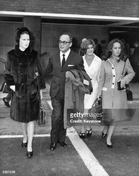 Film producer Dino De Laurentiis arrives, with his wife actress Silvana Mangano , to attend the British premiere of 'The Bible...In The Beginning' at...