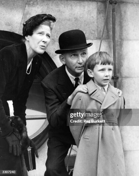 Marshal of the Royal Air Force Lord Arthur Tedder explains the proceedings to his son Richard as his second wife and they watch the Battle of Britain...