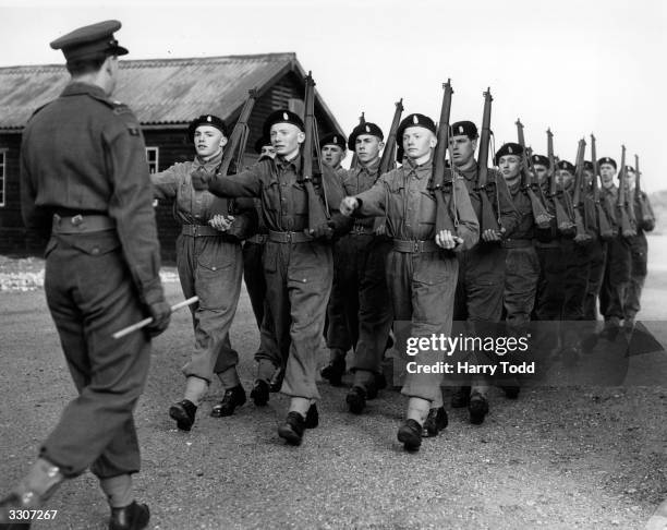 Year old triplets Allan, Brian and Dennis Kirkby reported to North Frith Barracks, Hampshire, following their call-up for National Service. They are...