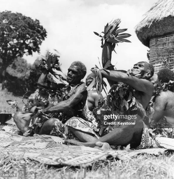 Welcoming ceremony in the Fiji Islands, which includes sit-down dance, special outfits, speeches, and a bowl of Kava, a traditional drink more or...