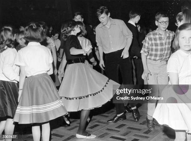 English actors Simon Williams and Jane Birkin dancing the twist at the Lyceum, London.