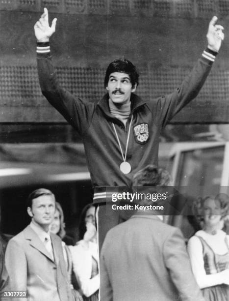 American swimmer Mark Spitz celebrates winning his fifth gold medal, in the 100 metres butterfly, at the 1972 Munich Olympics.