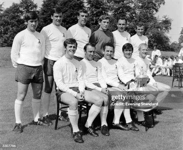 The Tottenham Hotspur football team with the FA Cup trophy Kinnear, Cyril Knowles, Mike England, Pat Jennings, Alan Gilzean, Alan Mullery, Robertson,...