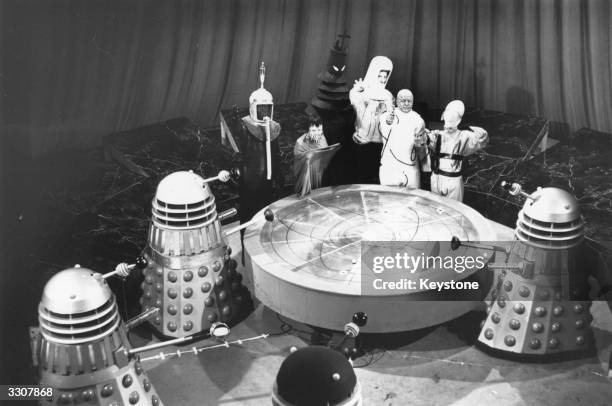 Scene from 'Mission to the Unknown', an episode of the popular British television sci-fi series 'Doctor Who', shows a meeting in the Dalek city on...