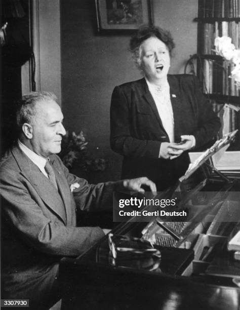 German-born US soprano Elisabeth Schumann rehearses with German-born US pianist and conductor Bruno Walter, for the first Edinburgh Festival,...