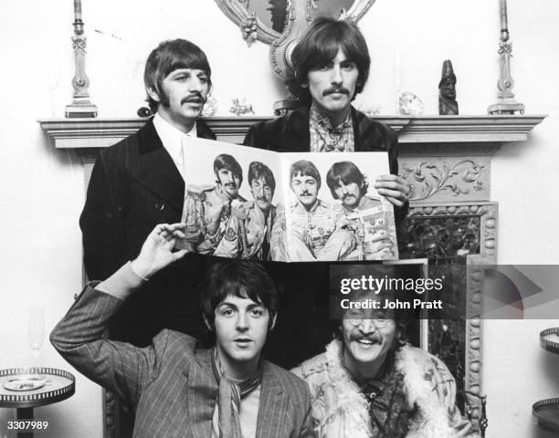 The Beatles pose for a photocall to promote their new album 'Sergeant Pepper's Lonely Hearts Club Band'.