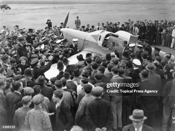 English aviator Amy Johnson arrives at Croydon, after setting a new record for a solo flight from Cape Town to London.