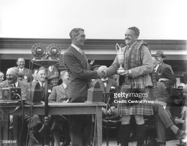 Scottish golfer Tommy Armour is presented with the British Open trophy at Carnoustie. This was Armour's final victory in one of the four major...