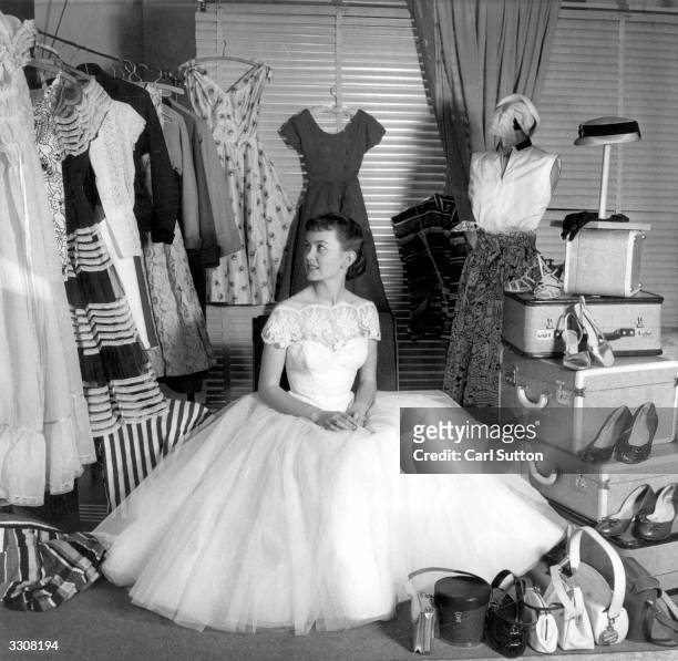 British leading lady and former child star Janette Scott inspects her wardrobe and luggage, prior to her departure for the 1954 Film Festival at...