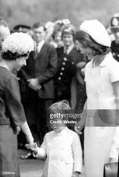 Queen Elizabeth II of Great Britain with John Kennedy Jr. , son of the late President John F Kennedy, and Jackie Kennedy during the inauguration of...