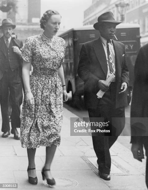Exiled chief of the Bamangwato in Bechuanaland Seretse Khama with his wife Ruth , out shopping in London.