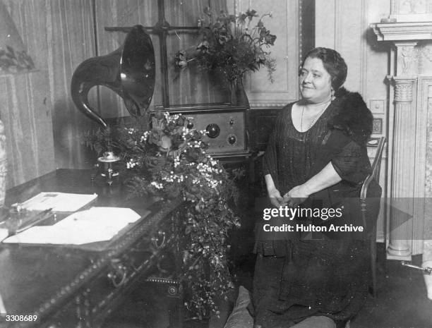 Madame Terazzini , one of the greatest living singers, getting ready to broadcast from her suite at the Savoy Hotel.