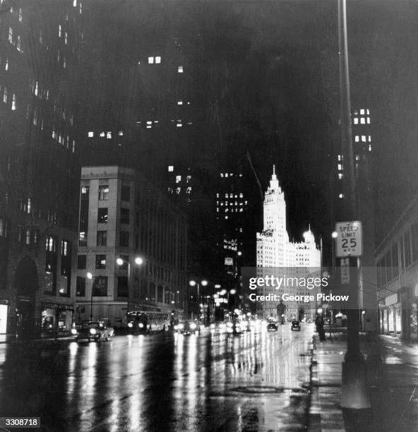 View down Michigan Avenue in Chicago, Illinois, with the Wrigley Building lit up in the background.