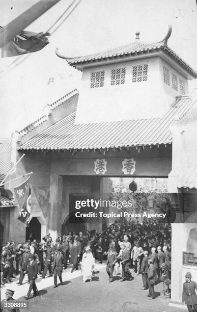 The Royal visitors entering the Hong Kong section at the British Empire Exhibition, Wembley. King George V and Queen Mary are with the King and Queen...