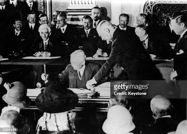 Jurist statesman Frank Billings Kellogg at the signing of the Kellogg-Briand pact in Paris.