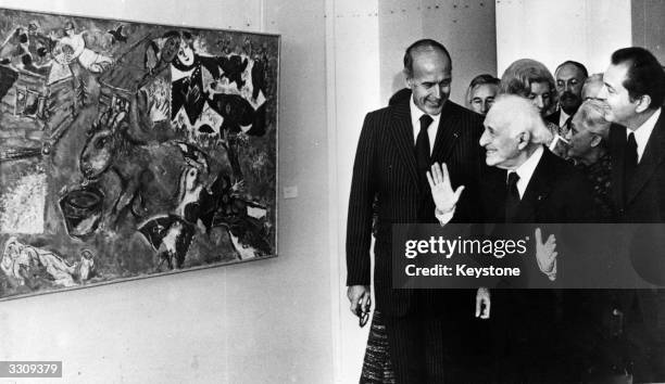 French painter Marc Chagall is delighted to come face to face with one of his paintings, accomapanied by the French President Valery Giscard...