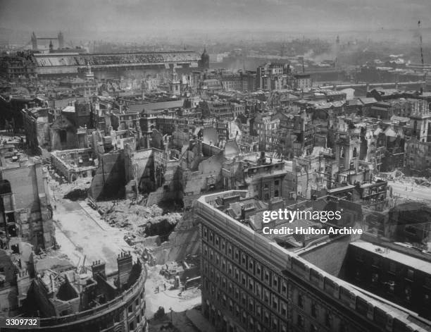 Bomb damage sustained by the City of London. Tower Bridge can be seen in the background.