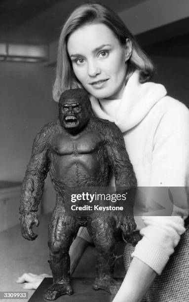 Film actress Jessica Lange who starred in a remake of 'King Kong', with a model of the famous gorilla, at a reception at the Savoy Hotel, London.