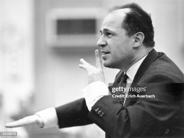French conductor and composer Pierre Boulez, signalling to the orchestra.