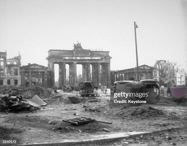 Wrecked vehicles on the Unter Den Linden near the Brandenburg Gate, Berlin.