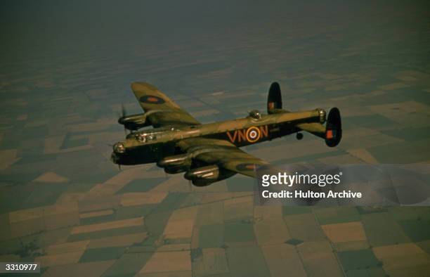 Avro Lancaster heavy bomber R5689 , of No. 50 Squadron RAF, in flight during World War II, 1942. The aircraft was delivered to 50 Squadron in June...