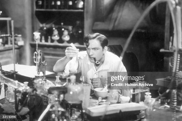 Fredric March plays Dr Jekyll about to drink the potion for the first time in a screen adaptation of the Robert Louis Stevenson book 'Doctor Jekyll...