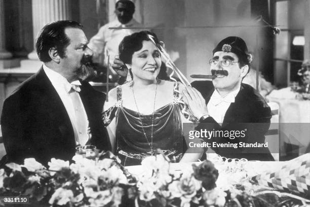 Margaret Dumont and Groucho Marx star in the film 'A Night at the Opera', directed by Sam Wood and produced by MGM.