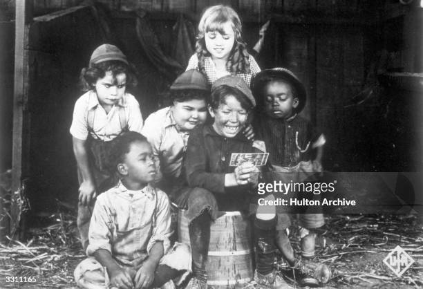 Promotional portrait of the child cast of the Hal Roach 'Our Gang' film series , circa 1923. Left to right: Jackie Condon , Eugene 'Pineapple'...