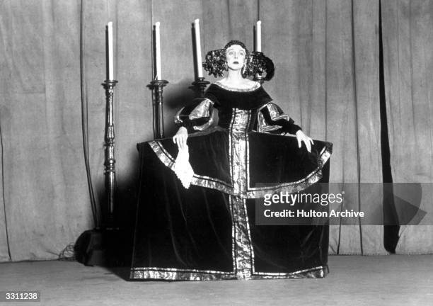 Lady Diana Cooper dressed as a Velasquez painting, during a rehearsal for a 'Living Tableaux', performed by society people in aid of the Marie Curie...