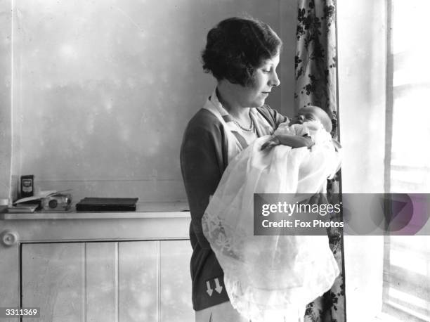 Barbara Cartland with her new baby Raine.