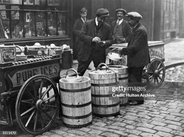 Man selling ice-cream on a street stall.