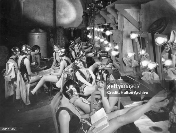 Dressing room full of chorus girls between scenes during the filming of 'Broadway'.