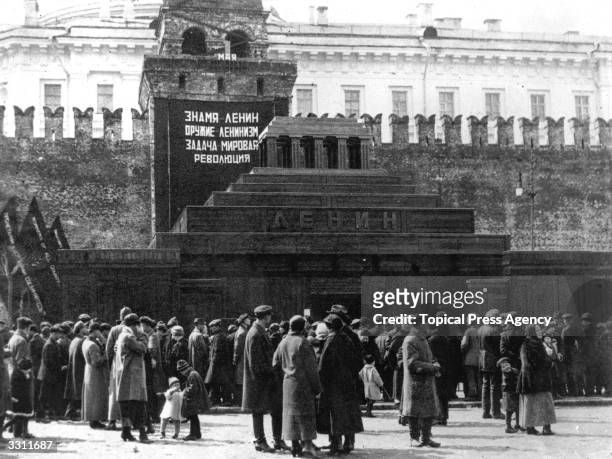 Russians paying their respects at Lenin's tomb during the May Day celebrations.