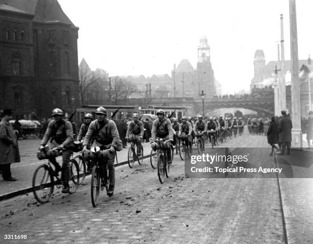 French soldiers entering Essen on bicycles during the Occupation of the Ruhr.