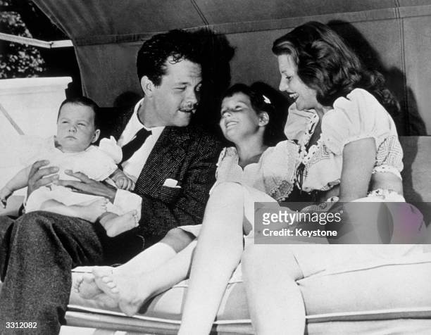 Rita Hayworth and her husband Orson Welles with their children, Rebecca and Christopher, Welles' daughter with Virginia Nicholson.