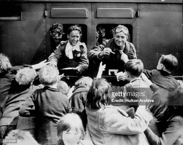 Children rush up to a train carrying Troops of the British Expeditionary Force , who have been repatriated in the Dunkirk evacuation, 26th May - 4th...