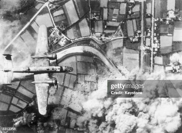 An American B-25 Mitchell bomber on a bombing run over France.