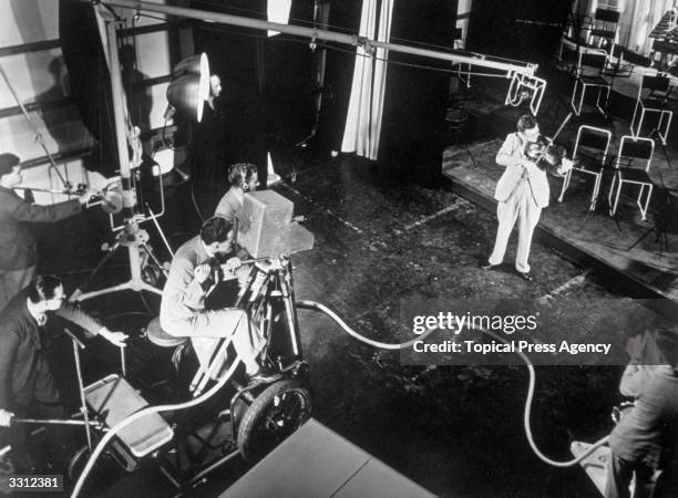 Mark Beard playing the viola in the Marconi-EMI television studios at Alexandra Palace, London.