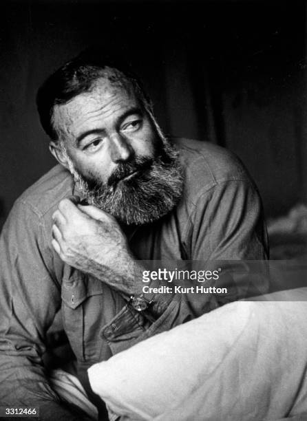 American writer and war correspondent Ernest Hemingway . Original Publication: Picture Post - 1748 - Hemingway Looks At The War In Europe - pub. 1944