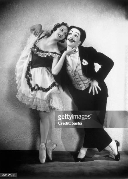 Leonide Massine and Alexandra Danilova , as the can-can dancers in Massine's ballet of 1919 'La Boutique Fantasque', presented by the Ballet Russe de...