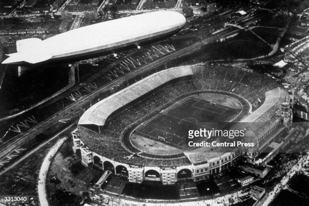 An aerial view of the Graf Zeppelin flying over Wembley Stadium in London during the 1930 FA Cup Final.