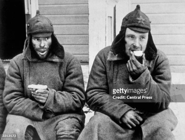 Two Russian prisoners eating their rations in a Finnish POW camp behind the lines. The Finns claimed their biggest victory against the Russians when...