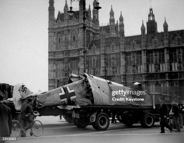 Messerschmitt aeroplane is paraded outside the Houses of Parliament, London, after being shot down by Spitfire pilots.